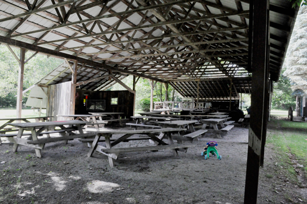 a shelter of tables, TV and more